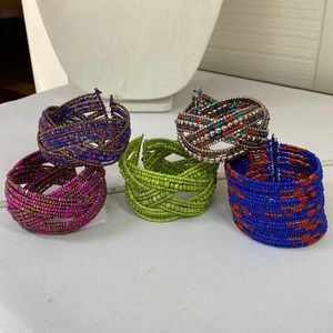 Five colorful boho wrap coil style bracelets